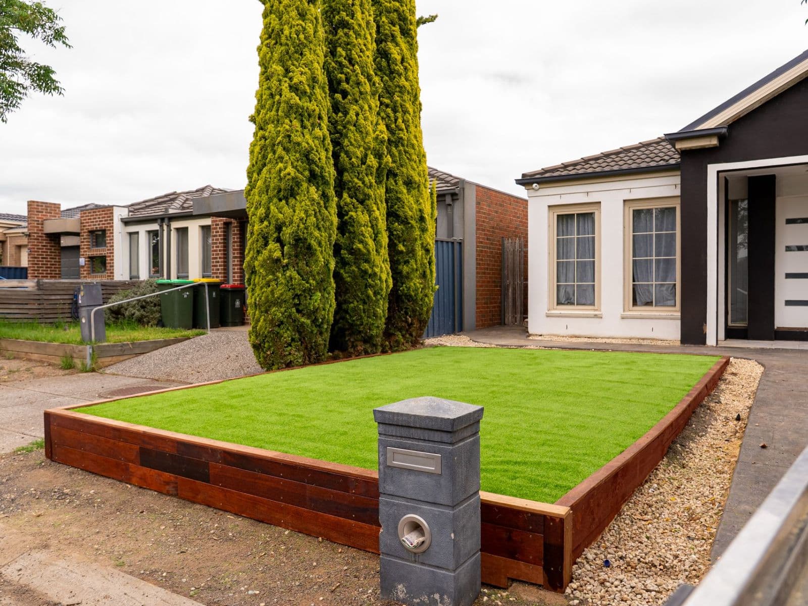 AYU front yard transformation — turf and timber edging