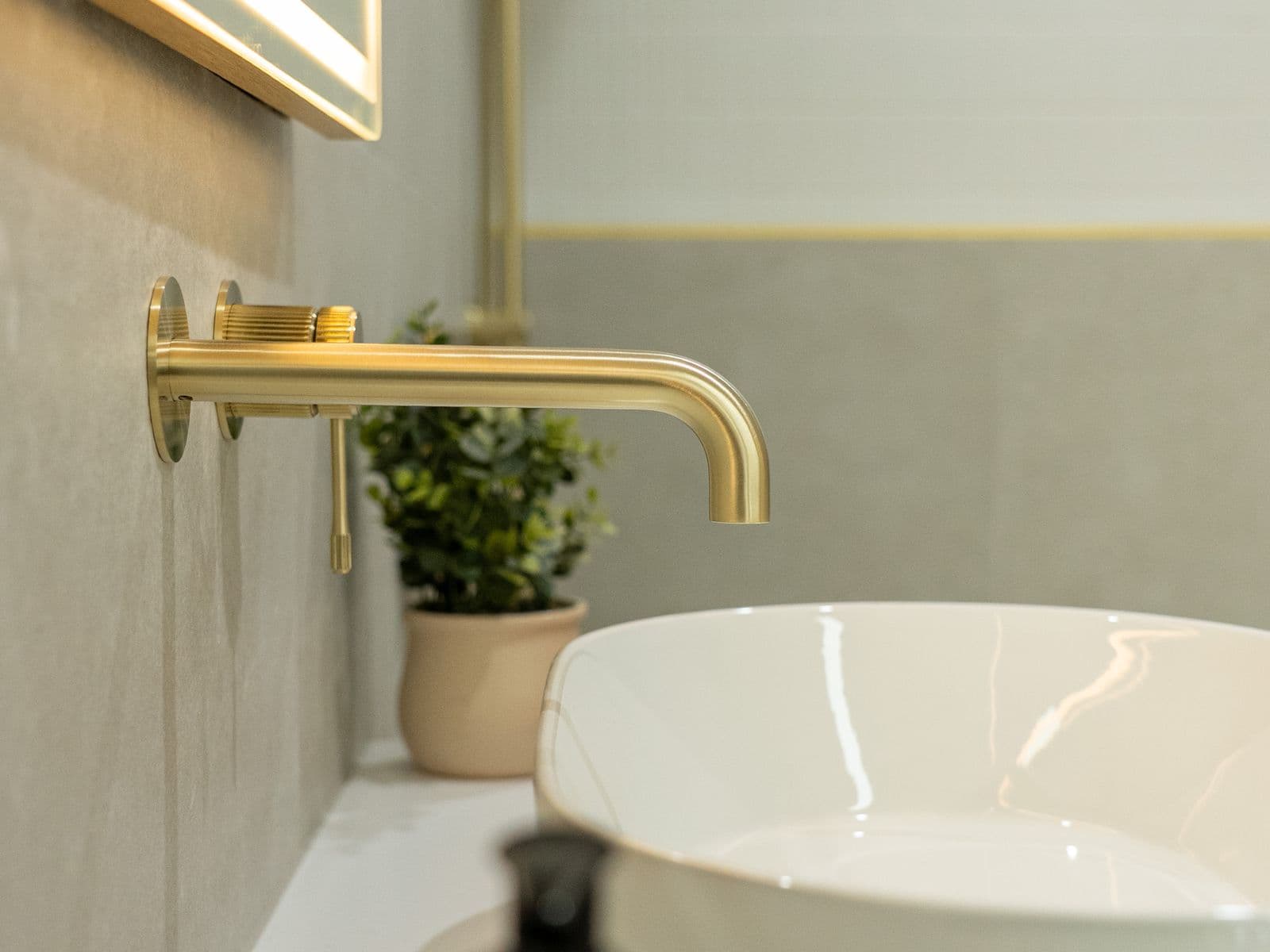 Brushed brass tapware detail — SLE bathroom